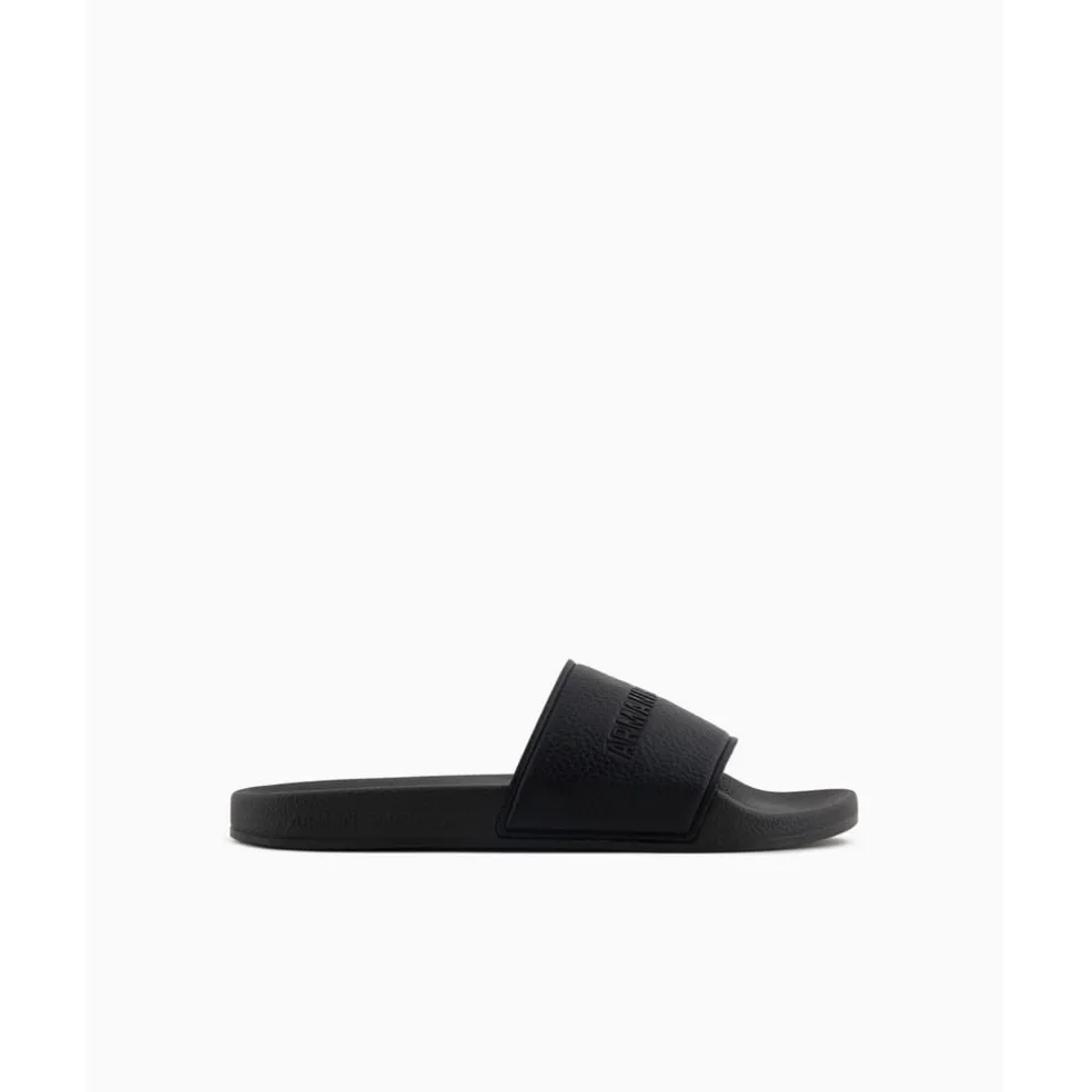 Armani Exchange Exchange Textured Open Toe Flat Slides in Black
