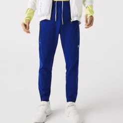 Lacoste Sport Zip Pockets Tapered Tracksuit Bottoms in Multi colour