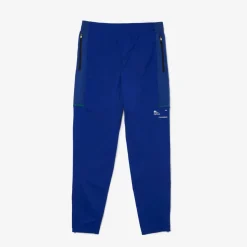 Lacoste Sport Zip Pockets Tapered Tracksuit Bottoms in Multi colour