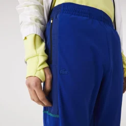 Lacoste Sport Zip Pockets Tapered Tracksuit Bottoms in Multi colour
