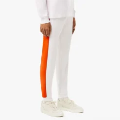 Lacoste Tapered Leg Sweatpants in white orange