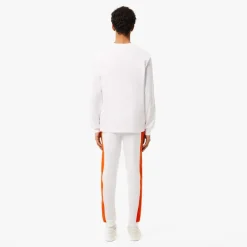 Lacoste Tapered Leg Sweatpants in white orange
