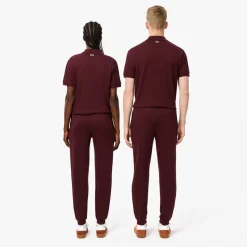Lacoste Tapered Leg Sweatpants in red maroon
