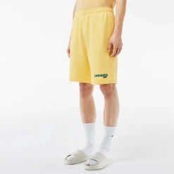 Lacoste Washed Effect Printed Fleece Shorts in Yellow